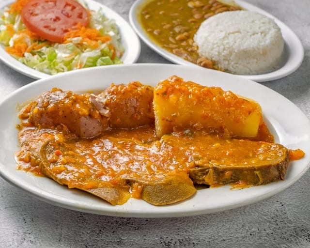 Lengua En Salsa / Steamed Beef Tongue with Creole Sauce.