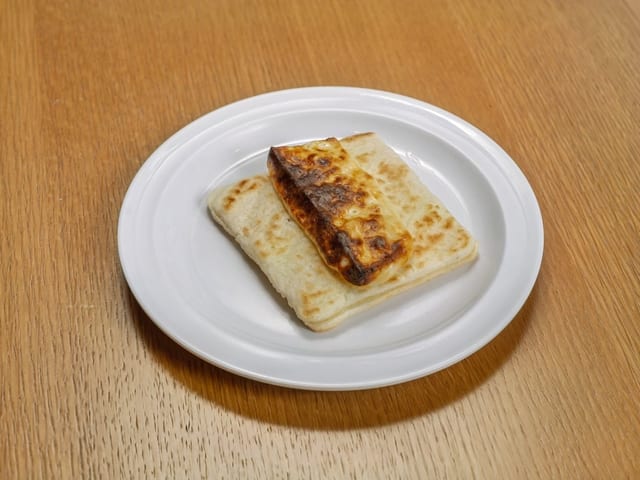 Arepa Con Doble Queso / Corn Cake with Melted Cheese.