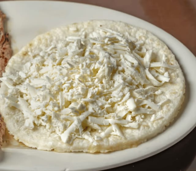 Arepa Tela / Flat Round Corn Cake with Cheese.