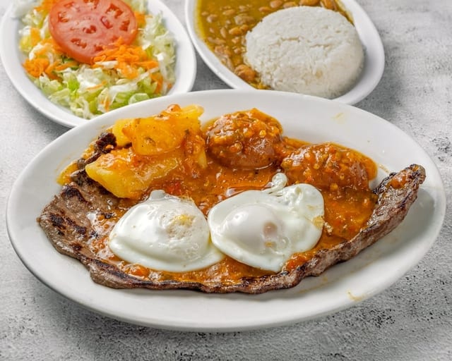 Bistec a Caballo / Grilled Steak with Creole Sauce & Egg.