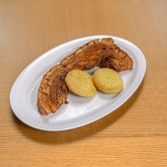 Chicharrón Con Arepa / Fried Pork Belly with Corn Cake.